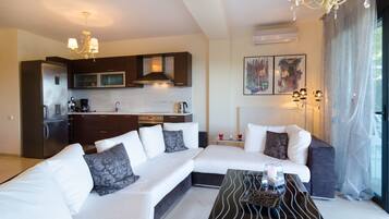 Apartment, 3 Bedrooms | Living room | LCD TV, fireplace