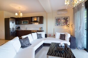 Apartment, 3 Bedrooms | Living room | LCD TV, fireplace