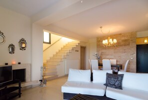 Apartment, 3 Bedrooms | Living room | LCD TV, fireplace