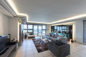 Appartement, 2 chambres | Coin séjour | Télévision à écran plat, cheminée