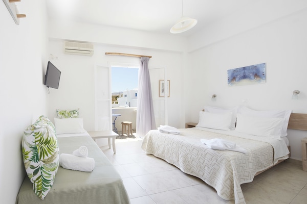 Triple Room, Garden View | Minibar, desk, iron/ironing board, free WiFi