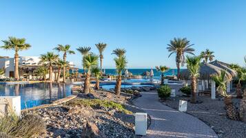 Outdoor pool, pool umbrellas, sun loungers