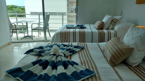 Family Condo, Pool Access, Courtyard View | Free WiFi, bed sheets - Vista Condominium by ChezPlaya (Playa del Carmen)