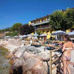 Private beach, white sand, sun loungers, beach umbrellas