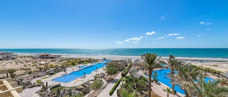 Outdoor pool, pool umbrellas, sun loungers