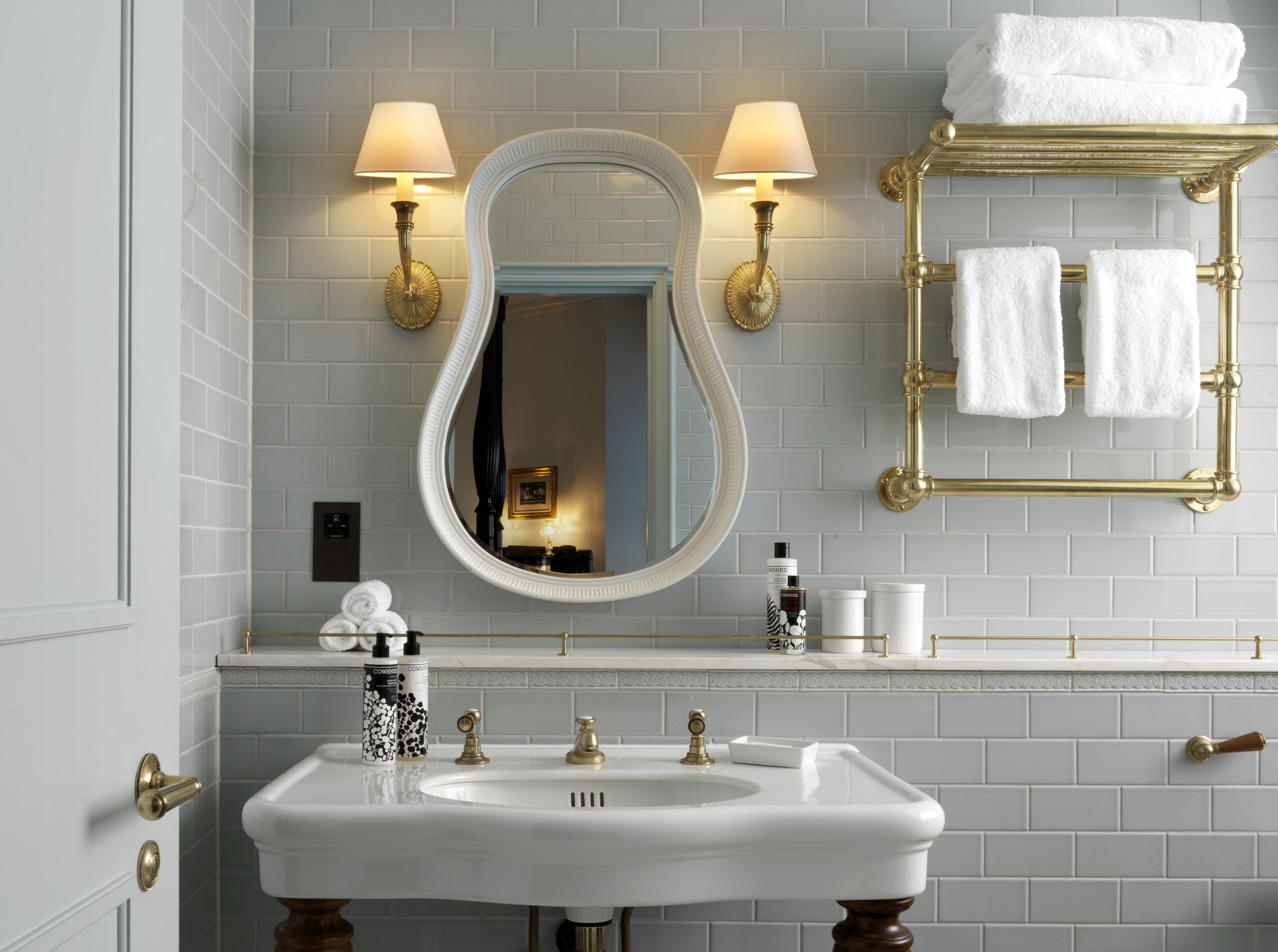 designer toiletries, hair dryer, bathrobes, slippers