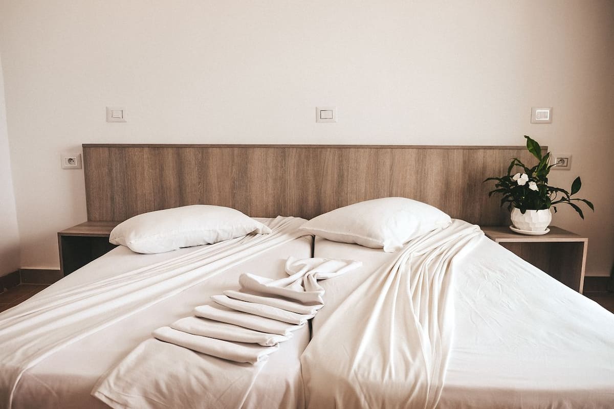 Double or Twin Room, Sea View | Iron/ironing board, rollaway beds, bed sheets