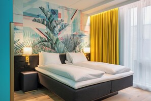 Ropa de cama de alta calidad, colchones con pillow-top y minibar 