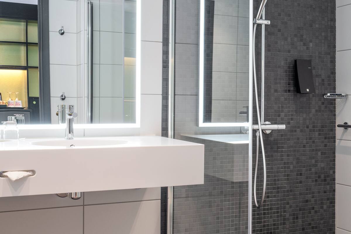 shower, rainfall showerhead, designer toiletries, hair dryer