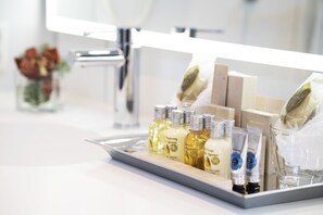 Shower, rainfall showerhead, designer toiletries, hair dryer