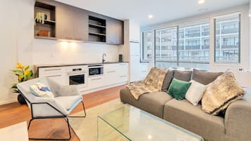 Superior Apartment, 1 Queen Bed | Living area | Flat-screen TV