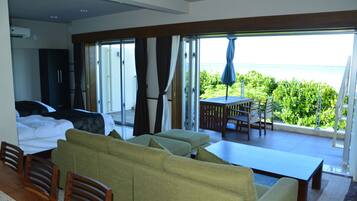 Family Room with Sea View | Living area | 50-inch flat-screen TV with cable channels