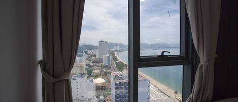 Apartment, 1 Bedroom, City View | Desk, soundproofing, iron/ironing board, free WiFi