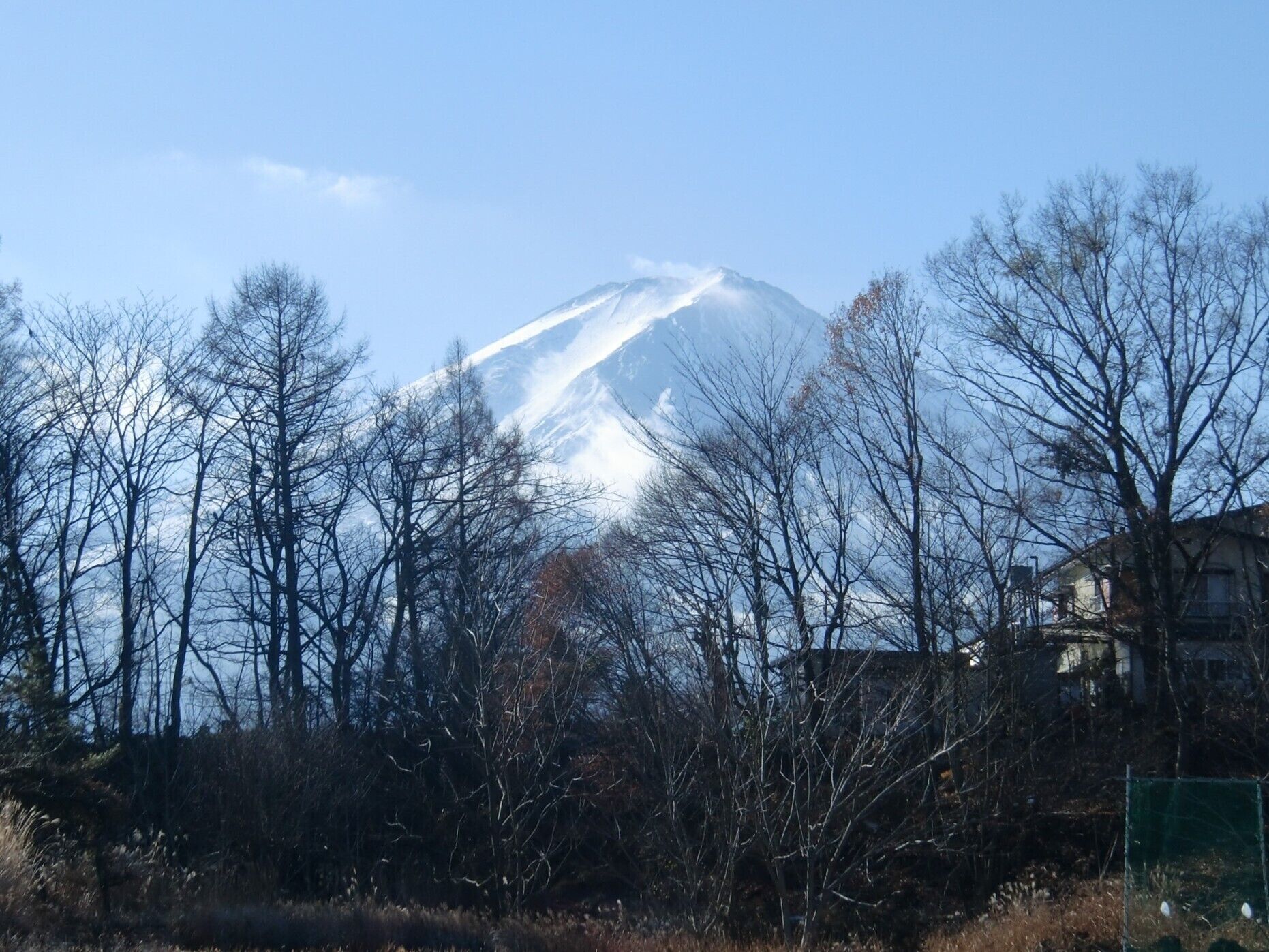 A snow-capped mountain with a clear sky.
