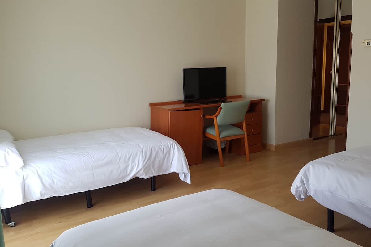 Standard Triple Room | Minibar, in-room safe, desk, soundproofing