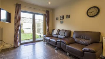 Basic Apartment, 2 Bedrooms | Living room | Flat-screen TV