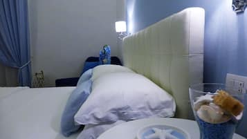 Habitación cuádruple (Cielo) | Ropa de cama de alta calidad, edredones de plumas, minibar y caja fuerte