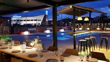 Enjoy a romantic dinner for two in our outdoor dining area overlooking the pool and surrounding landscape.