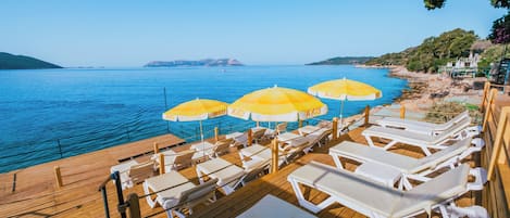 Sun loungers, beach umbrellas, beach bar