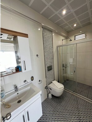 Family Room, Sea View | Bathroom | Shower, free toiletries, hair dryer, slippers
