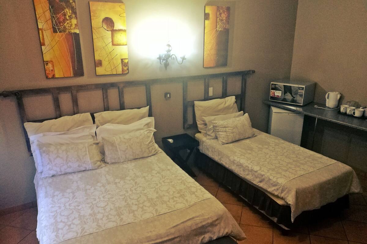 Family Quadruple Room | Desk, bed sheets