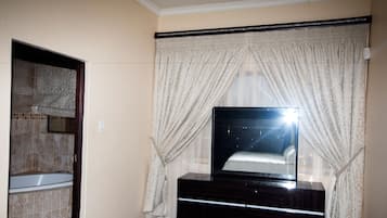 Standard Suite, 1 King Bed | Desk, iron/ironing board, free WiFi