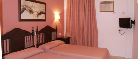 Desk, blackout curtains, free cots/infant beds, rollaway beds