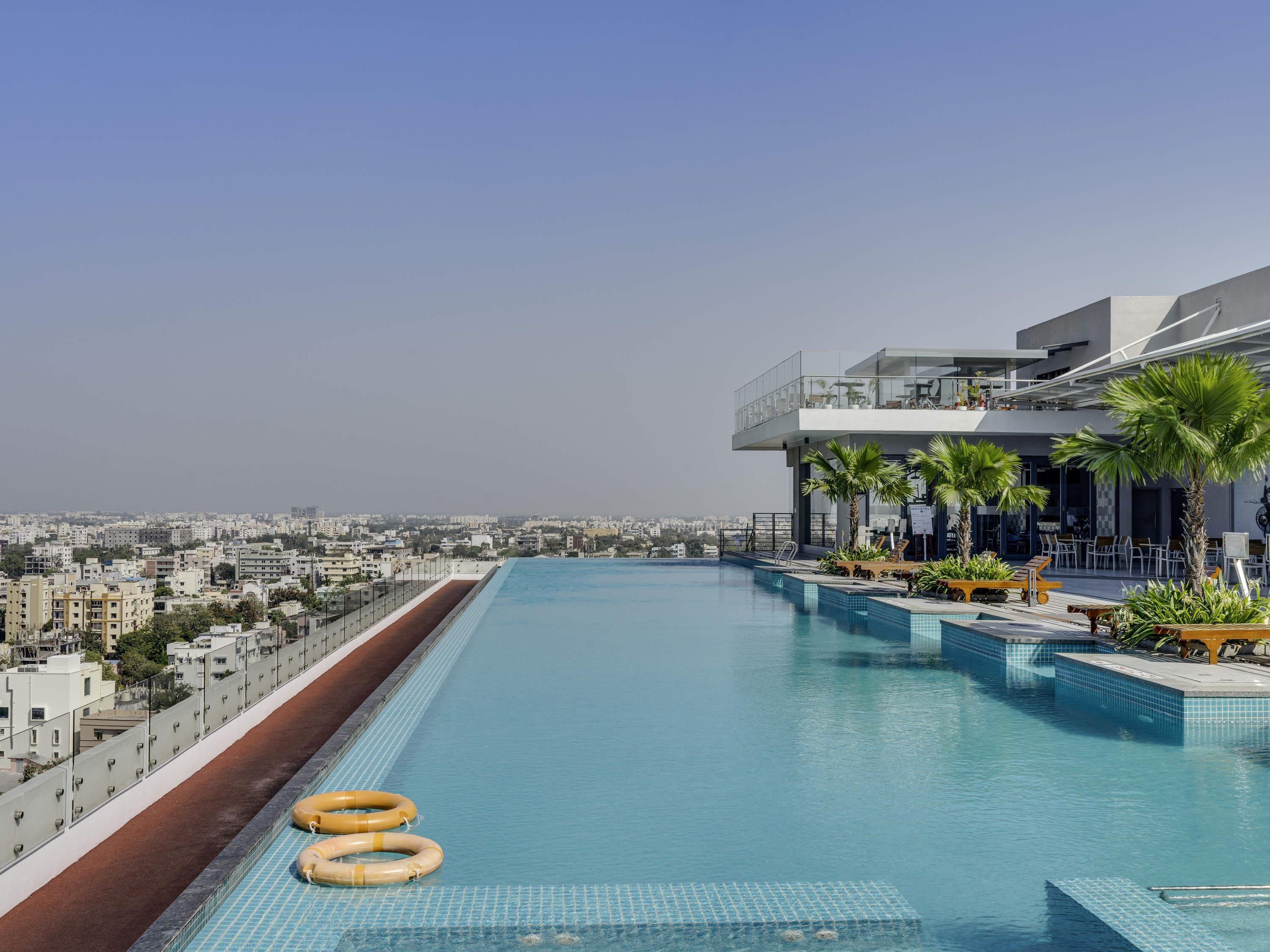 Outdoor pool, open 6:30 AM to 8:00 PM, pool umbrellas, pool loungers