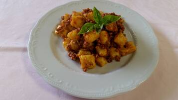A plate of food with a garnish on a white plate.