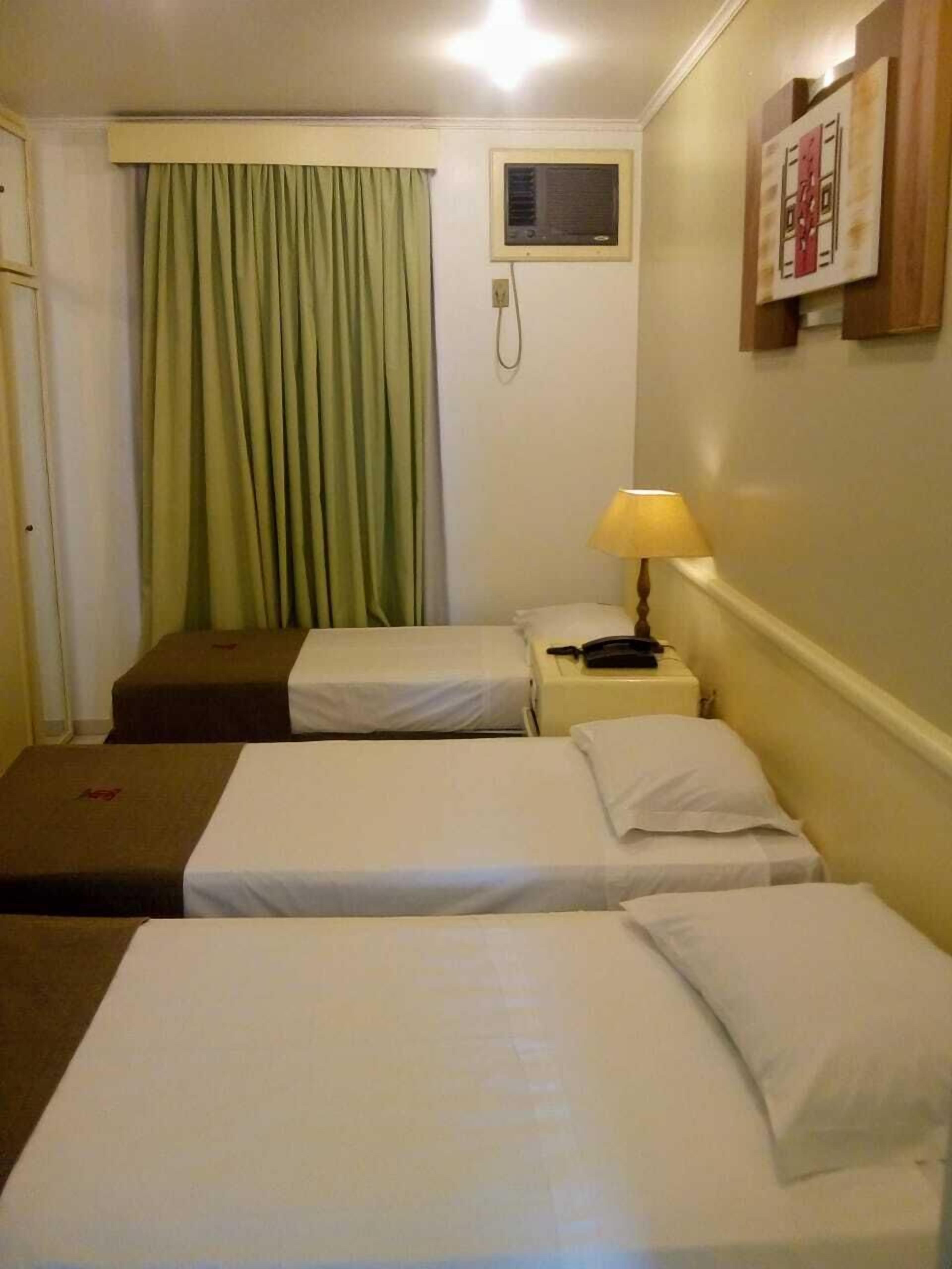 standard triple room, non smoking | minibar, desk, laptop workspace, blackout curtains