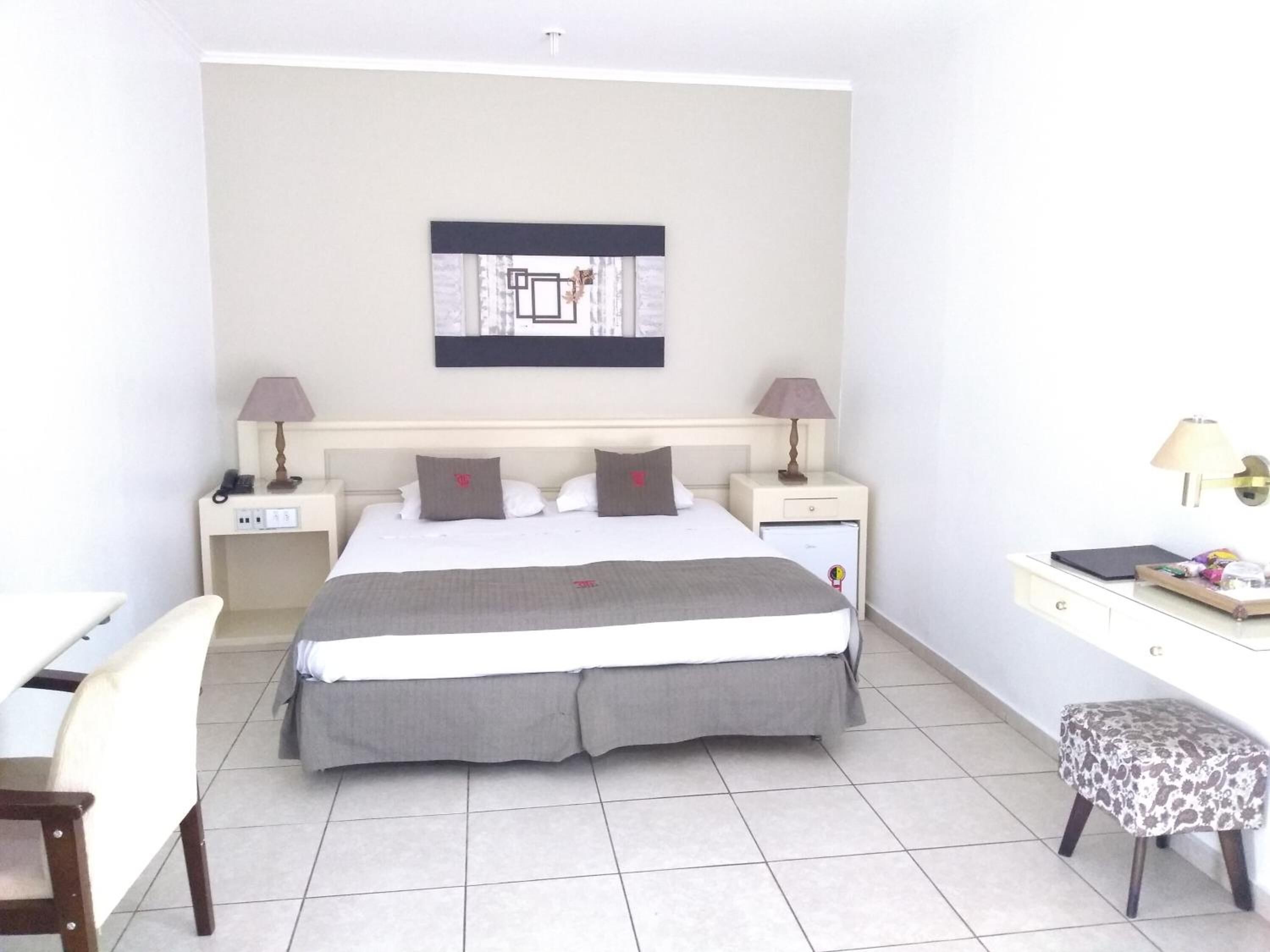 minibar, desk, laptop workspace, blackout curtains