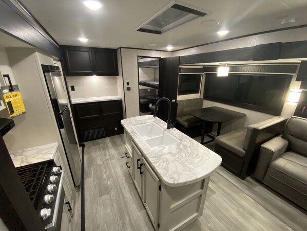 Luxury Mobile Home, 1 Queen Bed | Living area | 40-inch TV with digital channels, fireplace