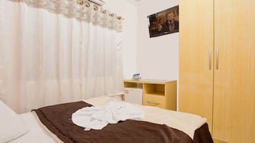 Frigobar, quartos à prova de som, Wi-Fi de cortesia, roupa de cama