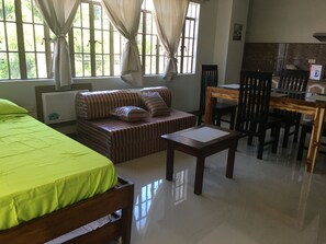 Family Suite, Multiple Beds | Private kitchen | Microwave, stovetop, coffee/tea maker, electric kettle - Beinte Singko de Marso Apartments (Candon)