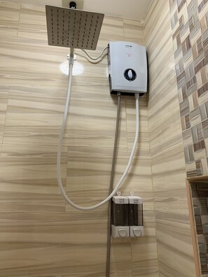 Family Room | Bathroom | Shower, rainfall showerhead, towels - Beinte Singko de Marso Apartments (Candon)