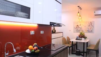 Standard Apartment | Private kitchen | Fridge, stovetop, electric kettle, cookware/dishes/utensils