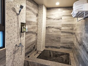 Elite Quadruple Room, 1 Bedroom | Bathroom | Combined shower/tub, deep soaking tub, rainfall showerhead