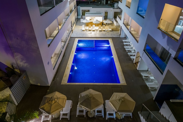Outdoor pool, open 10:00 AM to 6 PM, pool umbrellas, sun loungers