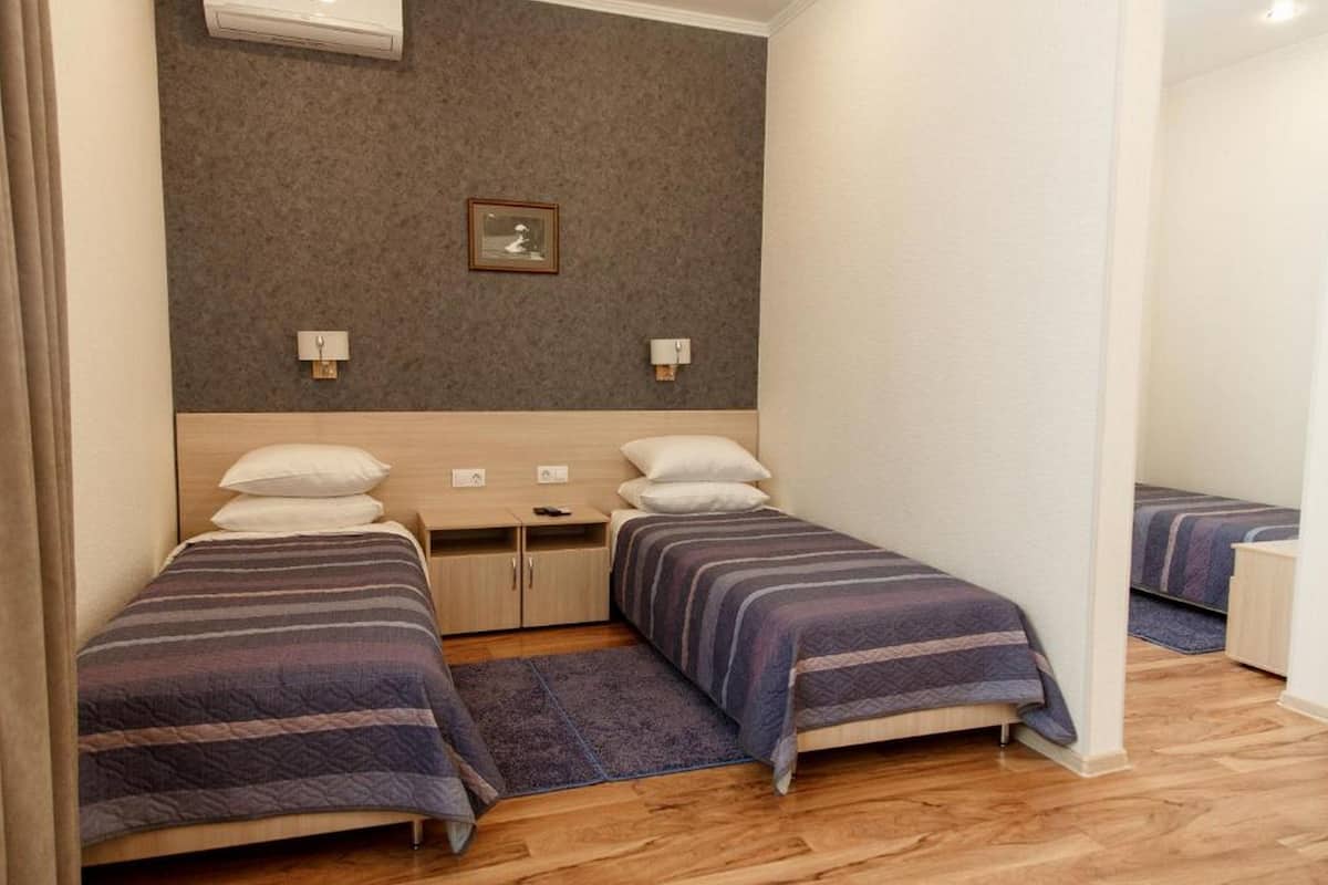 Family Room | Premium bedding, in-room safe, desk, iron/ironing board