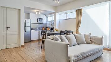 Apartment, 2 Bedrooms | Living area | 40-inch Smart TV with cable channels, TV