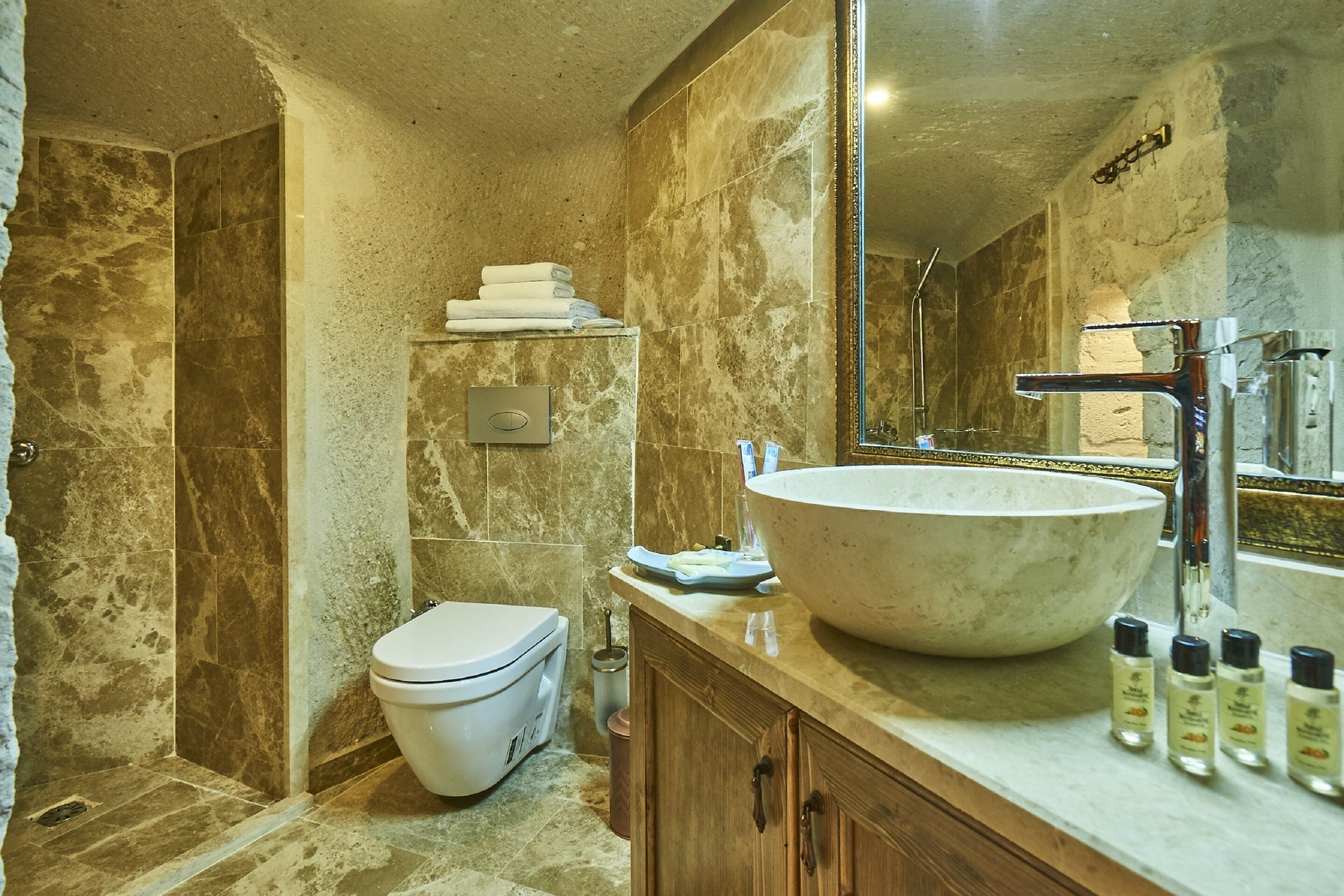 room (premier cave) | bathroom | shower, rainfall showerhead, hair dryer, slippers