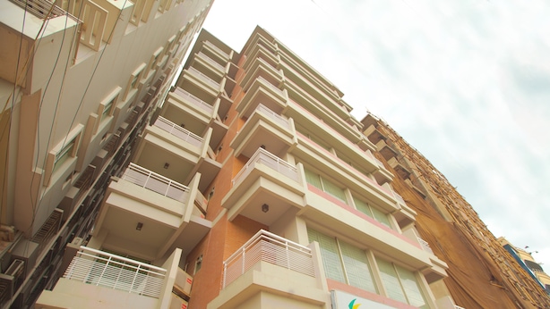A multi-story building with balconies and a sign for 'Bashatti Bay Resort'. - Bashati Bay Resort (Cox's Bazar)