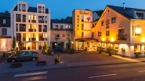 A hotel with a modern design, featuring a prominent 'Ruland Hotel' sign. - Hotel Ruland (Altenahr)