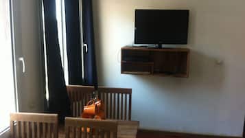 Basic Apartment, 1 Bedroom (Ambondrona) | Living area | 44-inch flat-screen TV with cable channels, TV