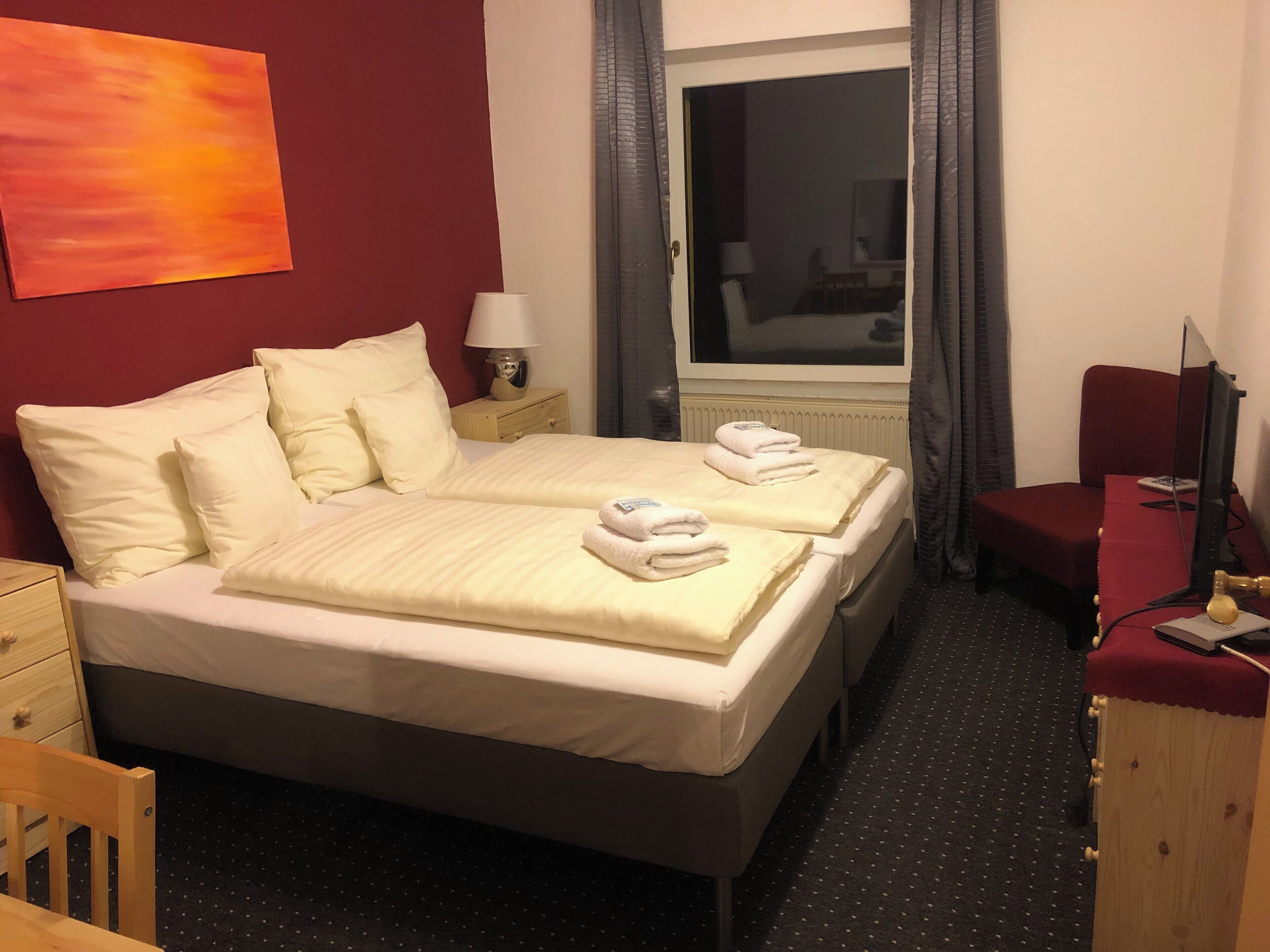 Premium bedding, blackout curtains, iron/ironing board (on request)