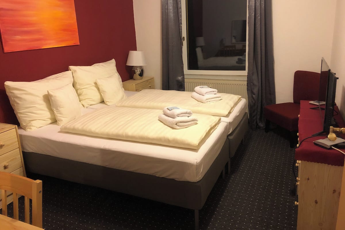 Premium bedding, blackout drapes, iron/ironing board (on request)