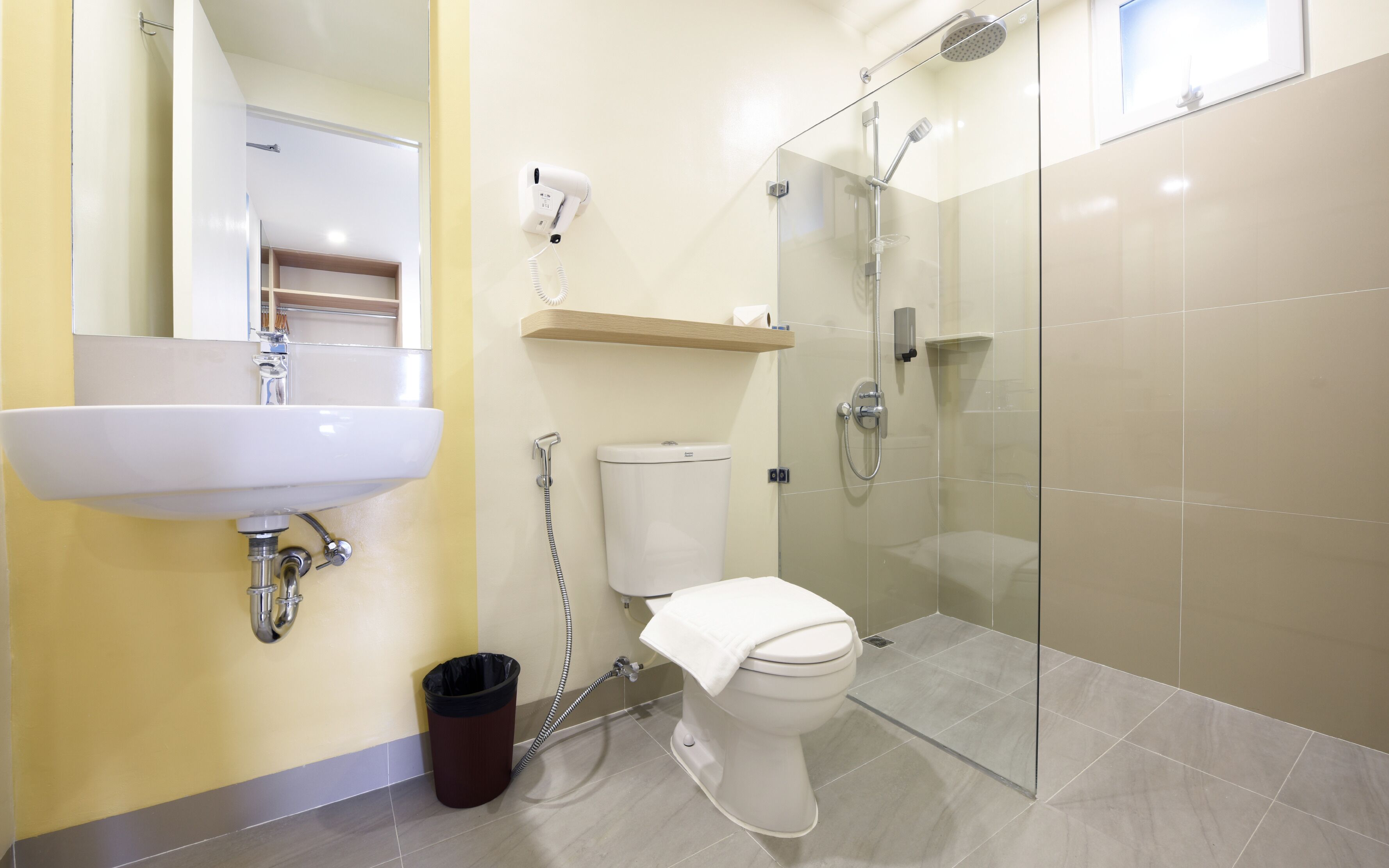 family room | bathroom | shower, hair dryer, bidet, towels