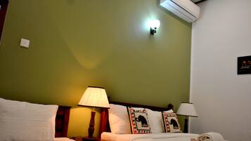 Deluxe Quadruple Room, Private Bathroom, Garden View | Minibar, in-room safe, desk, soundproofing
