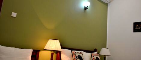 Deluxe Quadruple Room, Private Bathroom, Garden View | Minibar, in-room safe, desk, soundproofing