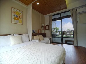 A hotel room with a large bed, a smaller bed, a wooden ceiling, a window with curtains, and a view of the outdoors. - Tian Yan Mountains (Jiaoxi)